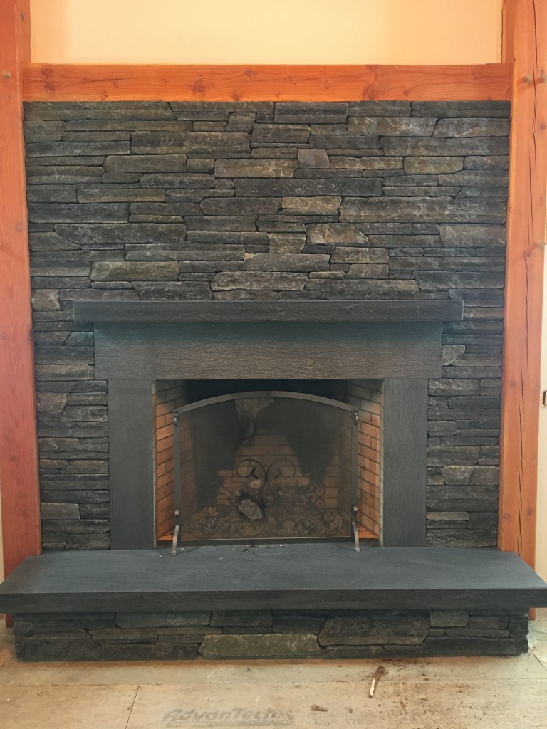 snapped 4" veneer and satin mantle, hearth and surround of Ashfield Schist work by Henry Jones Masonry