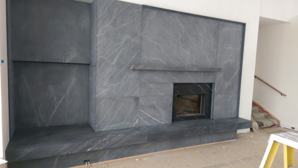 Quicksilver fireplace surround with natural cleft mantle
